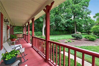 Wooden porch featuring a yard