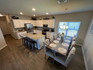 Kitchen featuring stainless steel appliances, bac