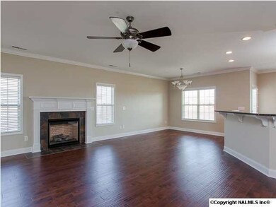 Enjoy family gatherings in your beautiful gathering room with hardwood flooring, gas fireplace, and loads of natural sunlight peeking in.