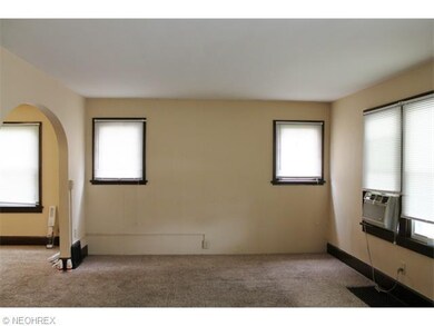 The spacious living room opens into the formal din