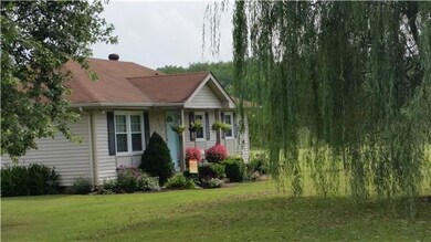 Beautiful yard, garden area, storage shed and garage