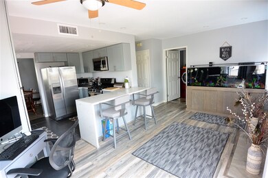 OPEN KITCHEN WITH QUARTZ COUNTERS AND STAINLESS ST