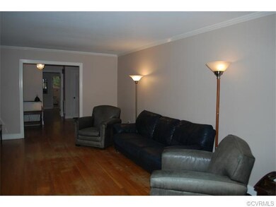 Living Room features hardwood floors and crown mou