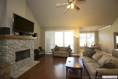 Stone fireplace with gas logs.
