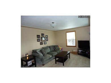 Living Room has newer windwows, blinds, outlets, s