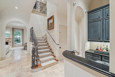 A grand entryway of timeless
elegance, the foyer