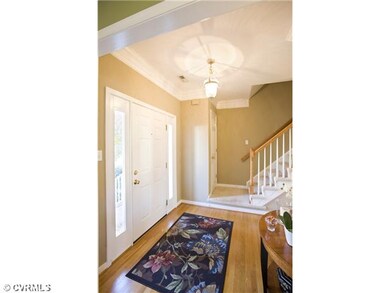 Foyer - Open Foyer featuring 3-tier crown molding 