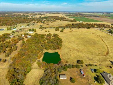 South west side Pond Aerial view of property's location with a large body of water and rural landscape