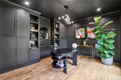 Office space featuring ornamental molding and ligh