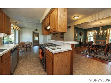 Kitchen opens to dining room