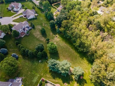 Entire backyard is surrounded by mature trees