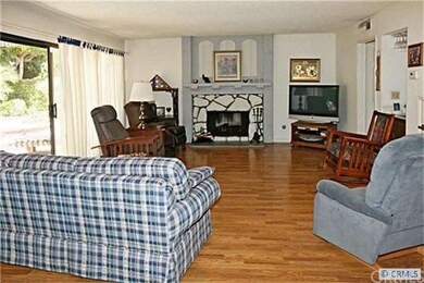 Family room with Fireplace, Wood Laminate Flooring