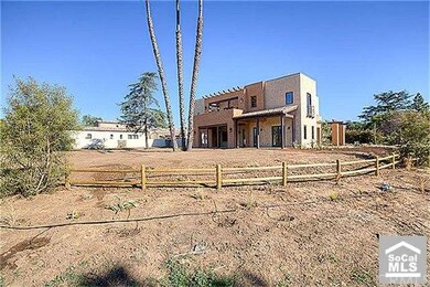 The sprawling yard offers room for a pool and spa.