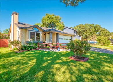 View of front of property with a garage, a chimne