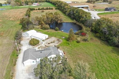 Five acres with pond and 2 outbuildings!