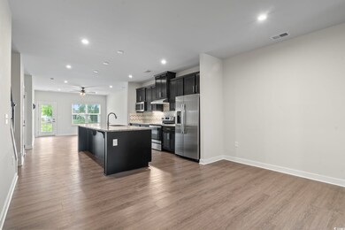 Open kitchen area with breakfast bar