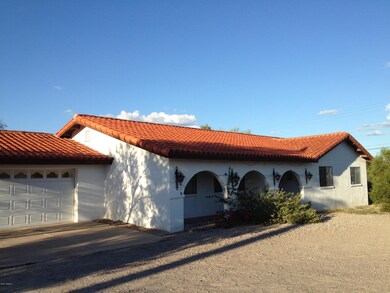 Two-car garage, large 3/4-acre property.