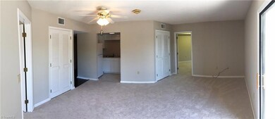 Living Room looking back towards the kitchen. Both bedrooms are either side of the living room.