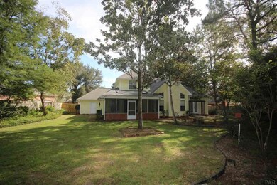 Sides of Yard. 3 Car Over sized garage.