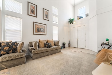 Living room with a high ceiling, light colored car