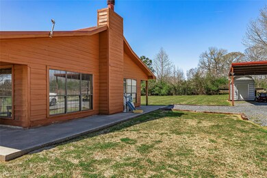 View of yard featuring a storage unit and an outdo