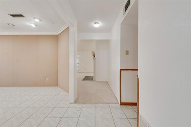 Corridor featuring a textured ceiling, light color