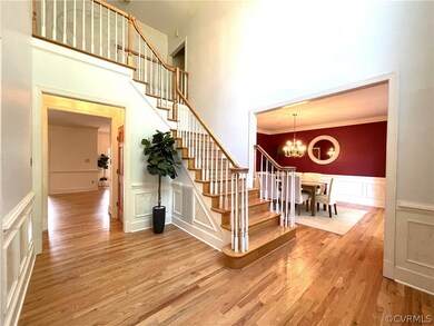 Stairs featuring a high ceiling, ornamental moldin