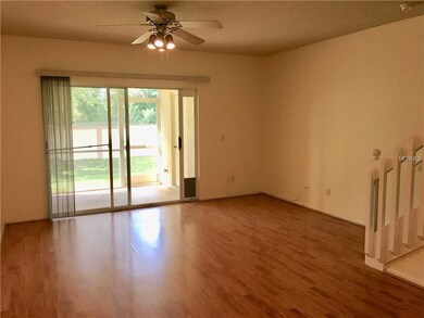 Living area looking toward back. Sliding doors lea