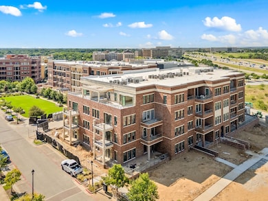 View of apartment building / complex with a city view