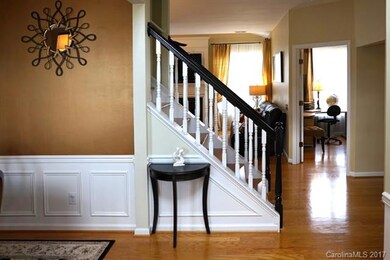 Foyer from front door looking into office and fami