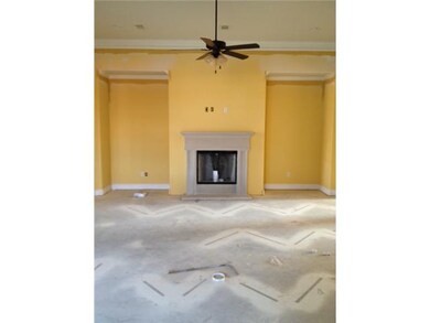 Spacious den is open to kitchen, entry, and dining