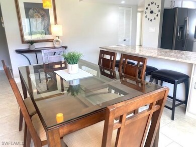 Dining room featuring light tile patterned floors