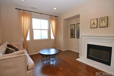 Living room with gas fireplace with natural light