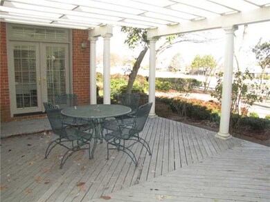 Relax on the large back patio with arbor overlooki