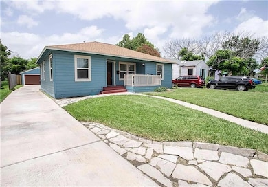 View of front of property with a porch, an outdoo