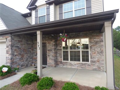Deep front porch is the perfect spot to enjoy a cu
