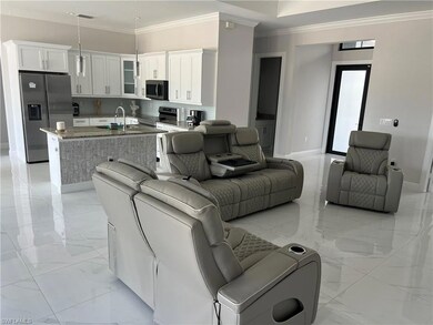 Living area featuring marble finish floor, a high 