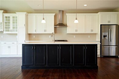 Hello gorgeous island!  Kitchen features large cen
