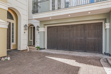 Dark-toned wooden doors shine under soft recessed