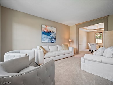Carpeted living area with a textured ceiling