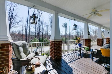Wrap around front porch overlooks preserved woods 