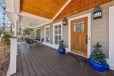 Wooden deck featuring covered porch and outdoor di