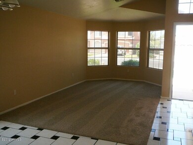 Freshly installed taupe carpeting