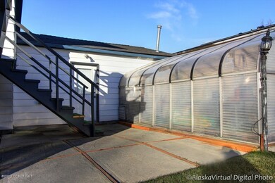 Patio, Man Door & Greenhouse