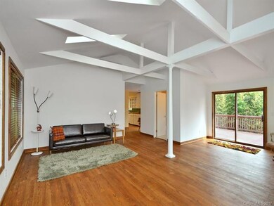 Living room with doors leading out to deck
