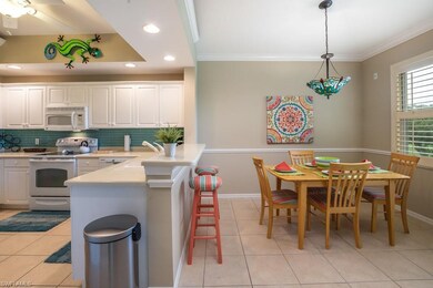 Condo Kitchen boasts both counter seating and brea