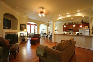 The Great Room opens into the Dining Room, Kitchen and Florida Room. Gleaming hardwoods, crown molding and corner fireplace provide an inviting room to relax and spend time with family and friends!
