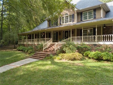 Full front porch, perfect for rockers! Freshly painted and with four ceiling fans.