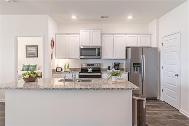 The delightful chef’s kitchen boasts a large cente