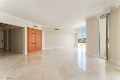 Spare room with ornamental molding and baseboards